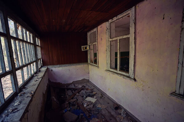abandoned house overgrown with wild plants