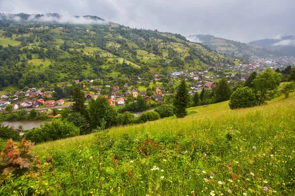 Mountain village landscape. Mountain village in mountain green valley panorama.