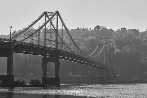 Pedestrian bridge across the Dnieper River, autumn landscape, Ki