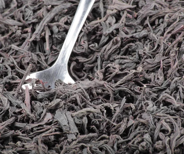 Black Tee Teaspoon — Stock Photo, Image