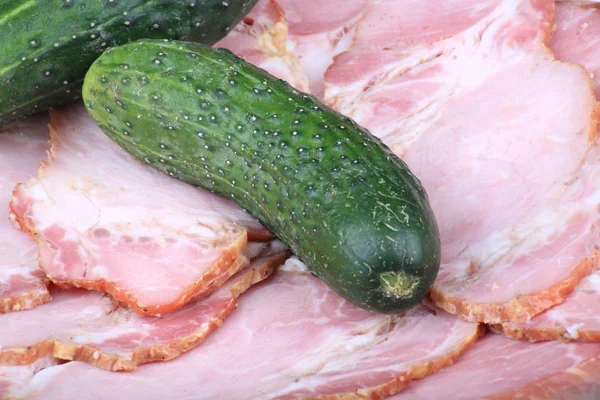 Cucumber on ham meat — Stock Photo, Image