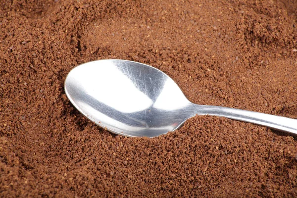 Milled coffee and one teaspoon — Stock Photo, Image