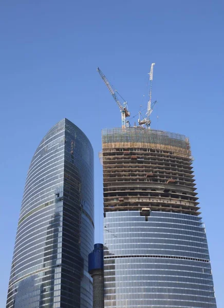 Skyscraper develop on sky background — Stock Photo, Image