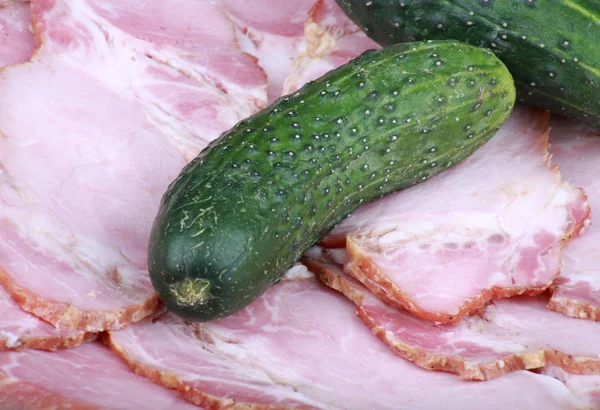 Cucumber on ham meat — Stock Photo, Image