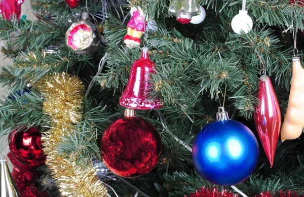 Toys on green christmas fir — Stock Photo, Image