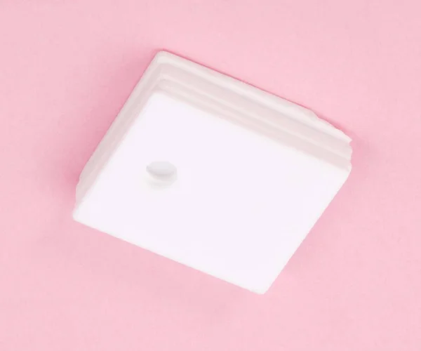Ceramic insulator on Pink Background — Stock Photo, Image