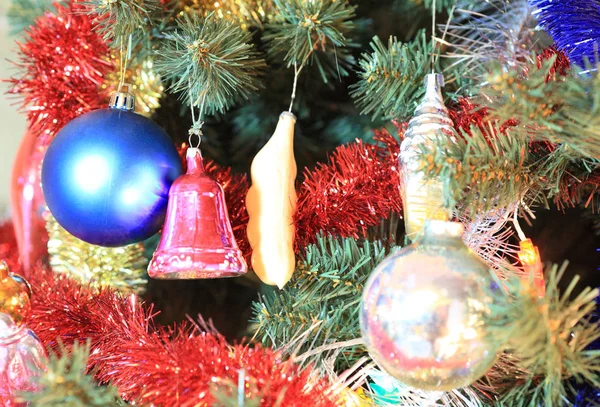 Toys on green christmas fir — Stock Photo, Image