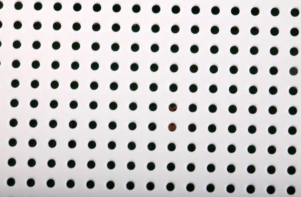 Plastic background with holes — Stock Photo, Image