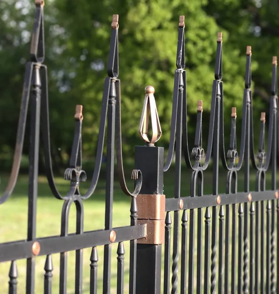 Fence with gold decoration — Stock Photo, Image