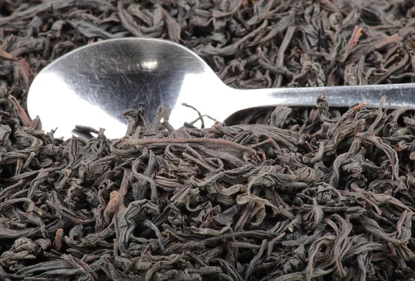 Black Tee Teaspoon Background — Stock Photo, Image