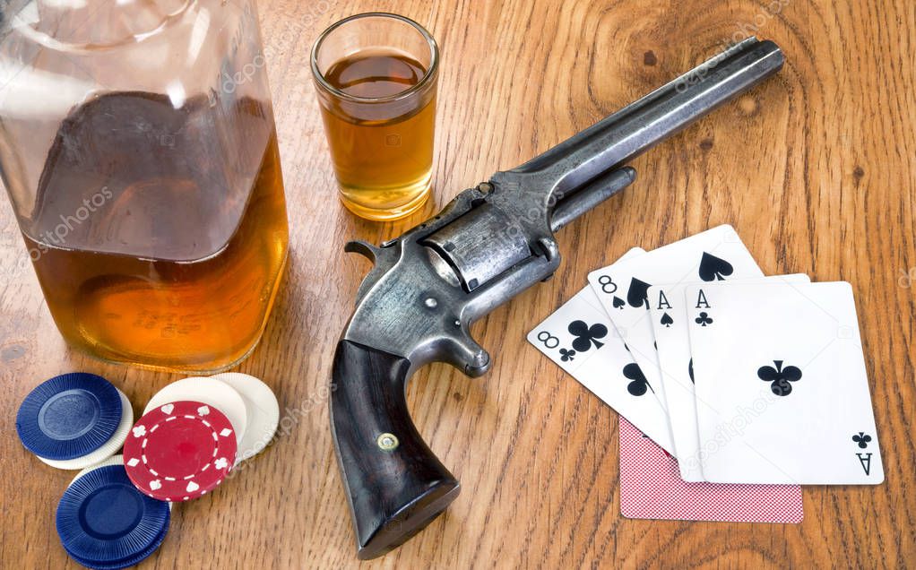 Dead mans hand aces and eights with Wild Bill's six shooter.