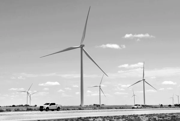 Wind turbine power of the West Texas farm lands in black and white.