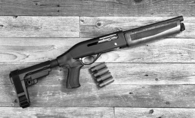 Home security 12 gauge short barrel semi- auto firearm/ shotgun in black and white.  clipart