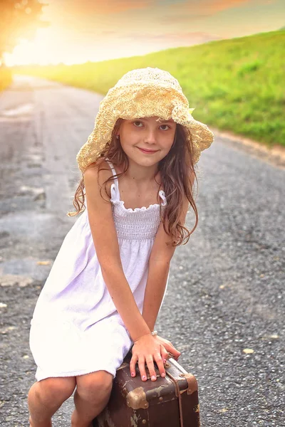 Girl Hat Sits Suitcase Road — Stock Photo, Image