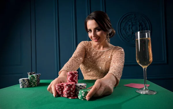 Young woman playing in casino