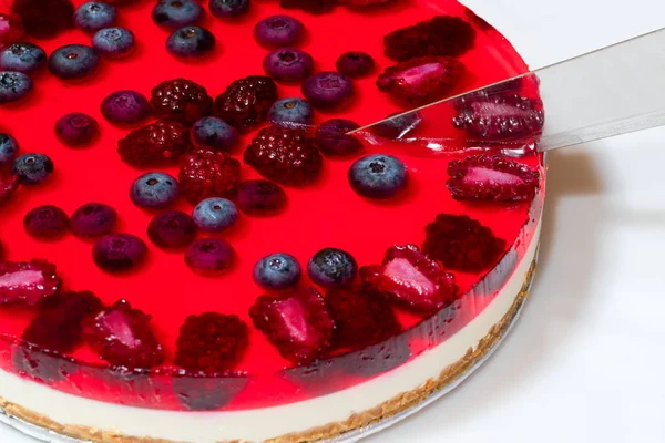 Red cheesecake with wild berries