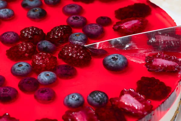 Red cheesecake with wild berries