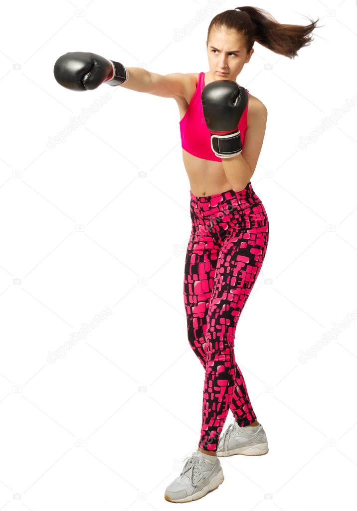 Young sporty kickboxer girl isolated