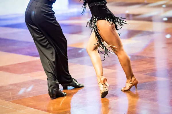 Beautiful womanish and masculine legs in active ballroom dance, indoors — Stock Photo, Image