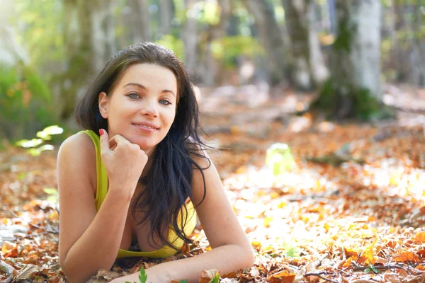 Young Woman Autumn Forest Laying Yellow Leaves Sun Shining Background — Stock Photo, Image