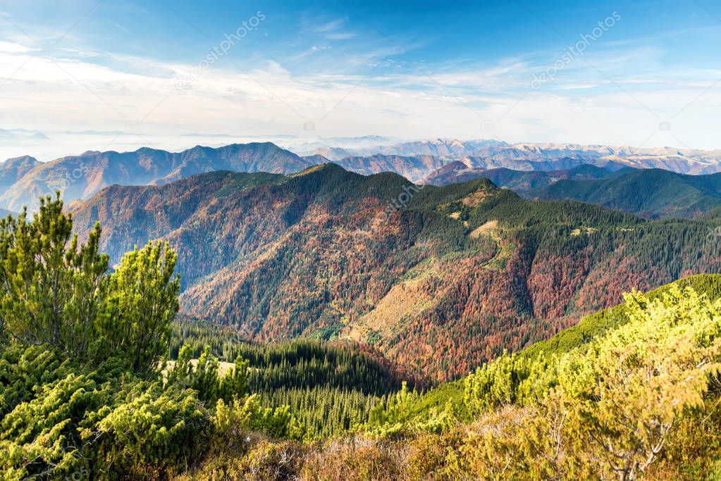 Landscape with colorful mountains ranges and autumn hills