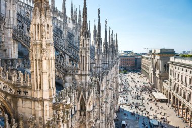 View from roof of Duomo gothic cathedral to piazza square in Milan clipart
