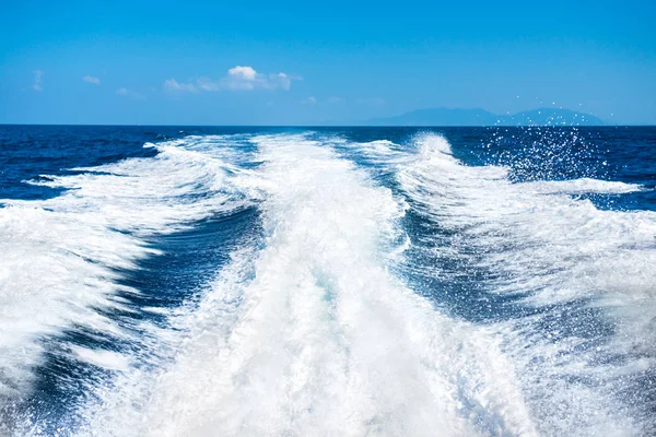 Wake of boat on water surface