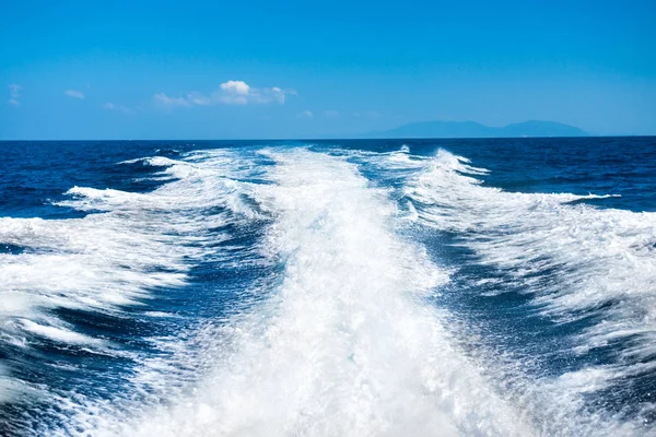 Wake of boat on water surface