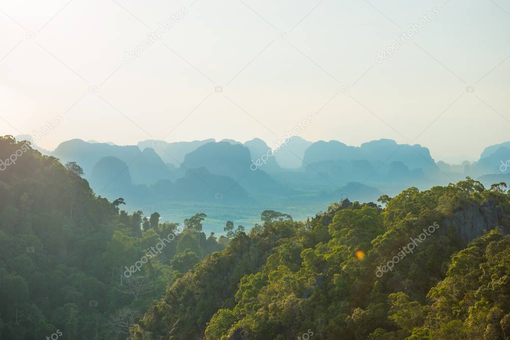 Tropical landscape with steep mountains at sunset