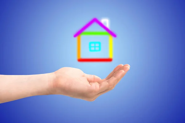 Small house in a hand — Stock Photo, Image