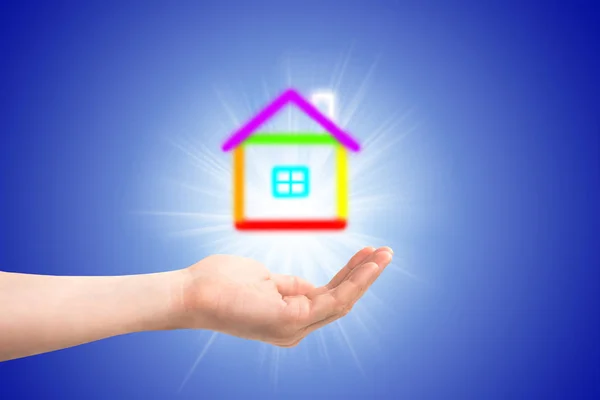 Small house in a hand — Stock Photo, Image