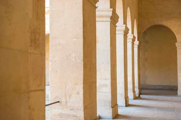 Corridor with arch and stone columns — Stock Photo, Image