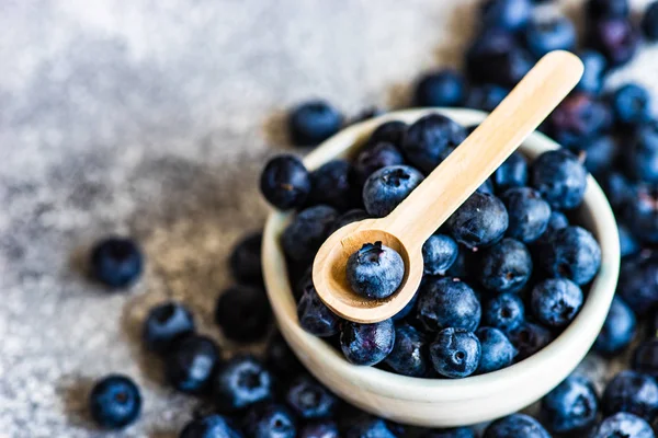 Organic blueberries on stone background — Stock Photo, Image