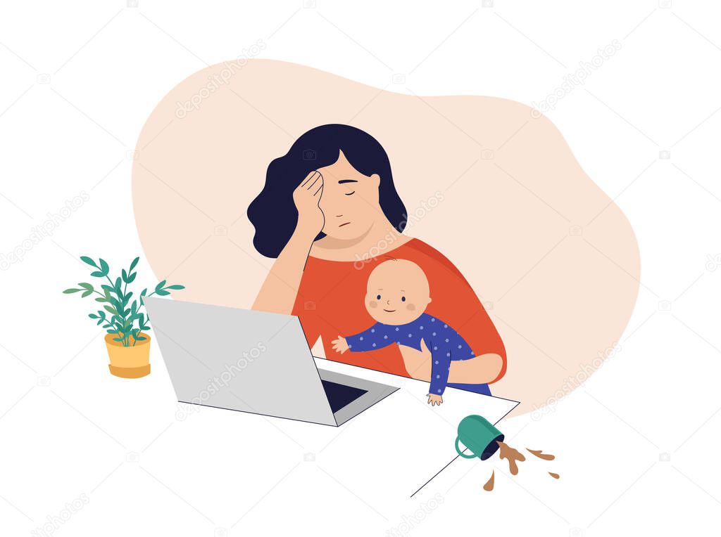 Tired mom trying to work, holding baby in her arms