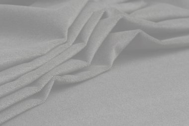 Buruşuk kumaş arka plan ve doku. Soyut arkaplan, boş şablon. Seçici odak.