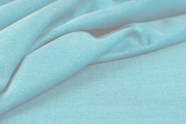 Buruşuk kumaş arka plan ve doku. Soyut arkaplan, boş şablon. Seçici odak.