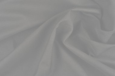 Tekstil ve doku konsepti. Buruşuk kumaş arkaplanının kapağı. Soyut arkaplan, boş şablon. Üst görünüm.