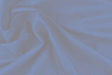 Tekstil ve doku konsepti. Buruşuk kumaş arkaplanının kapağı. Soyut arkaplan, boş şablon. Üst görünüm.