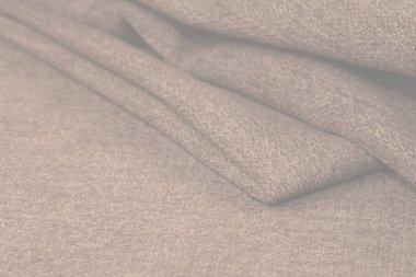 Buruşuk kumaş arka plan ve doku. Soyut arkaplan, boş şablon. Seçici odak.