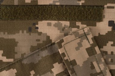 Kumaş kamuflaj deseni cepli. Yelek parçası. Soyut kamuflaj askeri Tekstil arka plan. Üstten Görünüm.