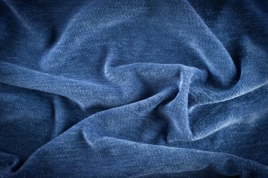 Tekstil ve doku konsepti. Buruşuk kumaş arkaplanının kapağı. Soyut arkaplan, boş şablon. Üst görünüm.