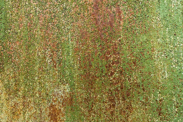 金属表面上の古いグリーン ペイントの断片は錆で覆われています 抽象的な背景とテクスチャー — ストック写真