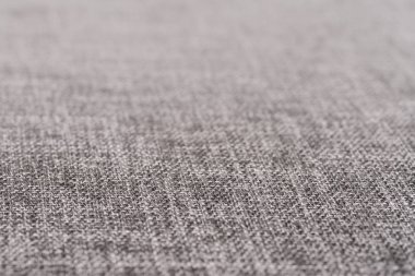 Gri kumaş dokusu. Arka plan boş şablon. Seçici odak.