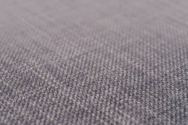 Gri kumaş dokusu. Arka plan boş şablon. Seçici odak.