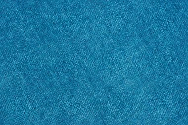 Mavi renkteki bir yün kumaş kapatın. Arka plan boş şablon. Üstten Görünüm.