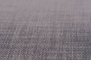 Gri kumaş dokusu. Arka plan boş şablon. Seçici odak.