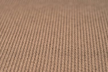 Kahverengi kumaş dokusu. Arka plan boş şablon. Seçici odak.