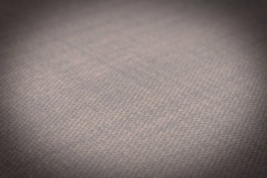 Kahverengi kumaş dokusu. Arka plan boş şablon. Seçici odak.