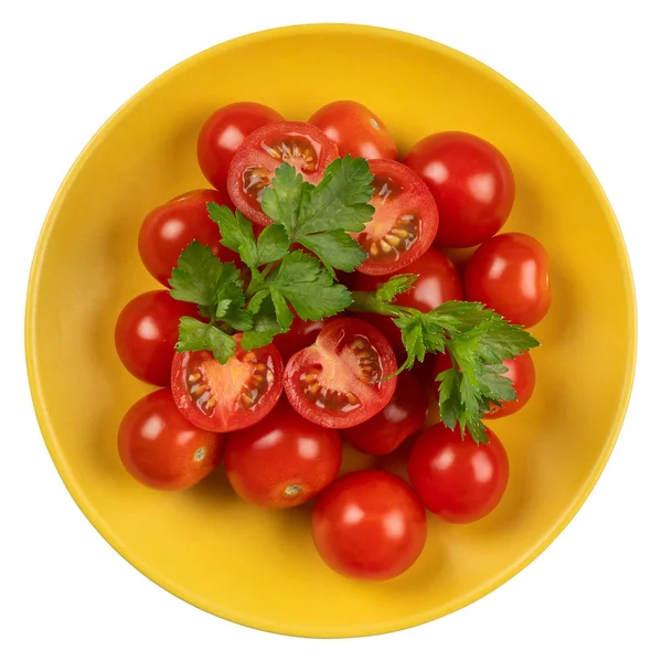 Tomaten in einem gelben Teller auf weißem Hintergrund. — Stockfoto