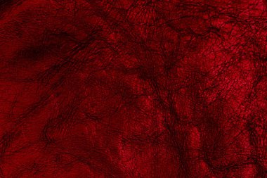Koyu kırmızı deri yüzeyi arka plan, deri doku olarak. 